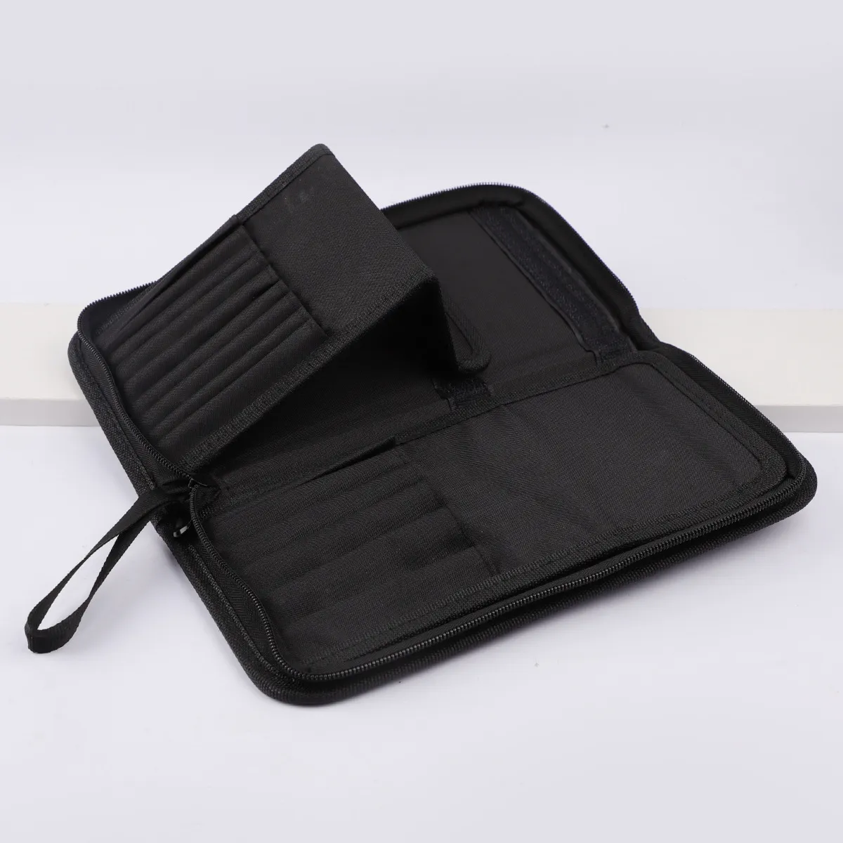 Große schwarze faltbare Make-up-Tasche mit 14–40 Löchern, Aufbewahrungsorganisator für Schönheitspinsel, Kosmetiktasche mit Griffen — image 3