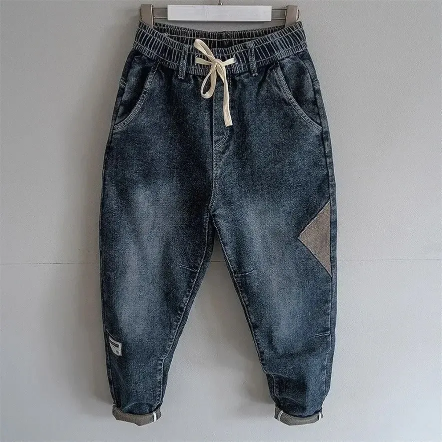 Jeans larghi elastici in vita in denim Primavera Autunno Pantaloni stile harem impiombati Pantaloni casual da uomo 2024 Jeans cargo larghi coreani nuovi elasticizzati