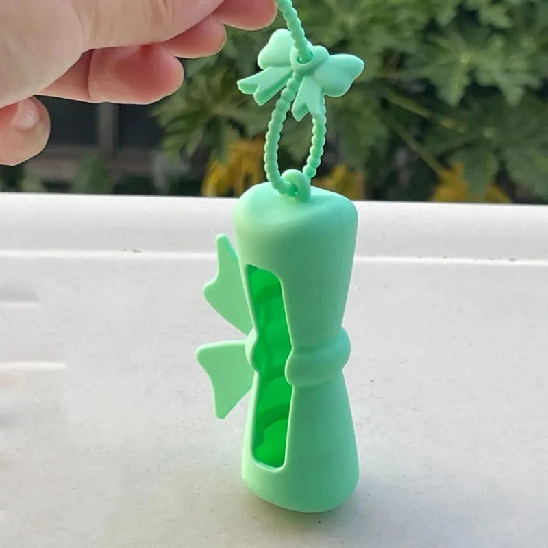 Bow Candy Peanut Shape Silikon Penutup Gincu Rantai Kunci Beg Simpanan Gincu Warna Pepejal Pemegang Balsem Bibir Ringan — image 9